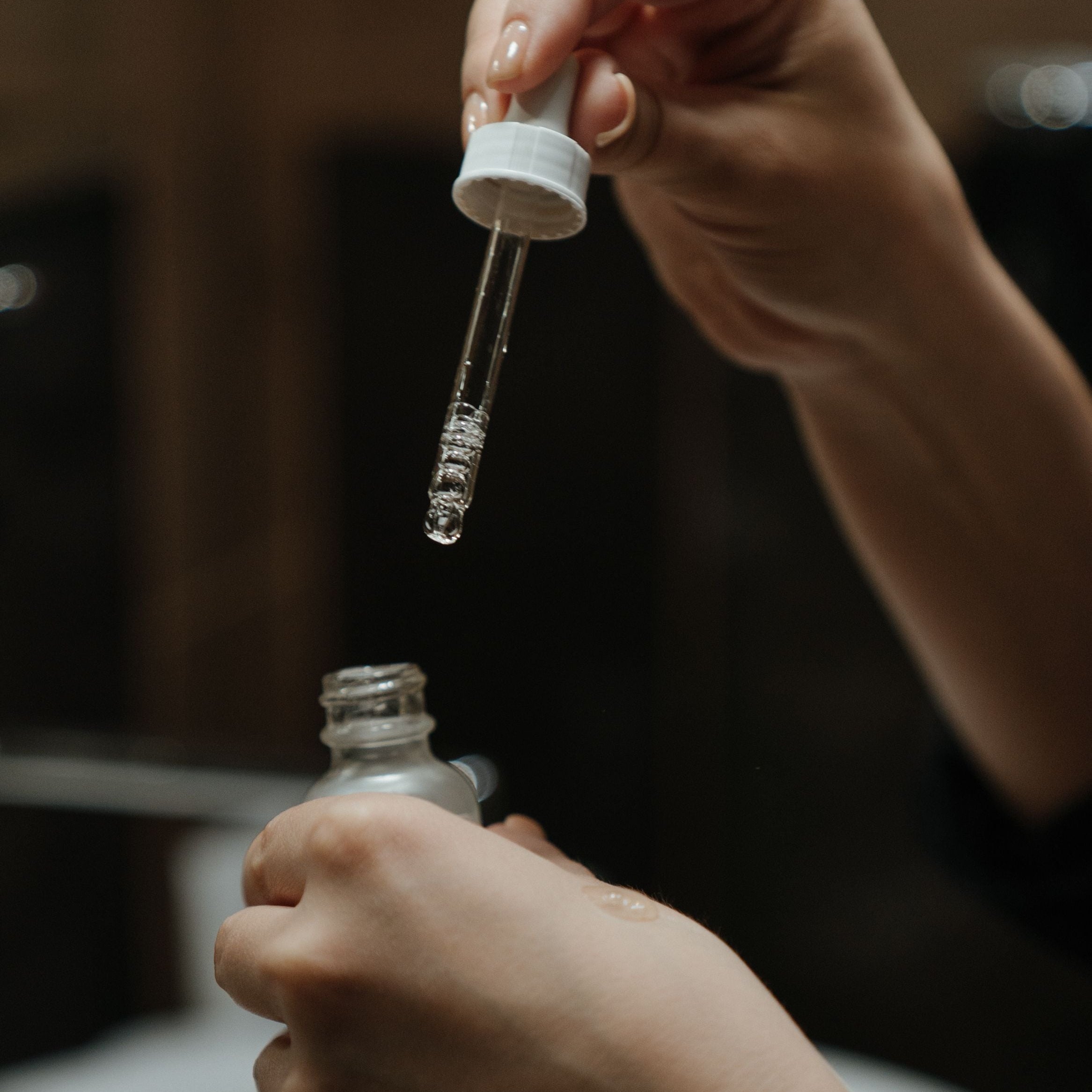 Tranexamic Acid in Skincare - women applying it on her hands