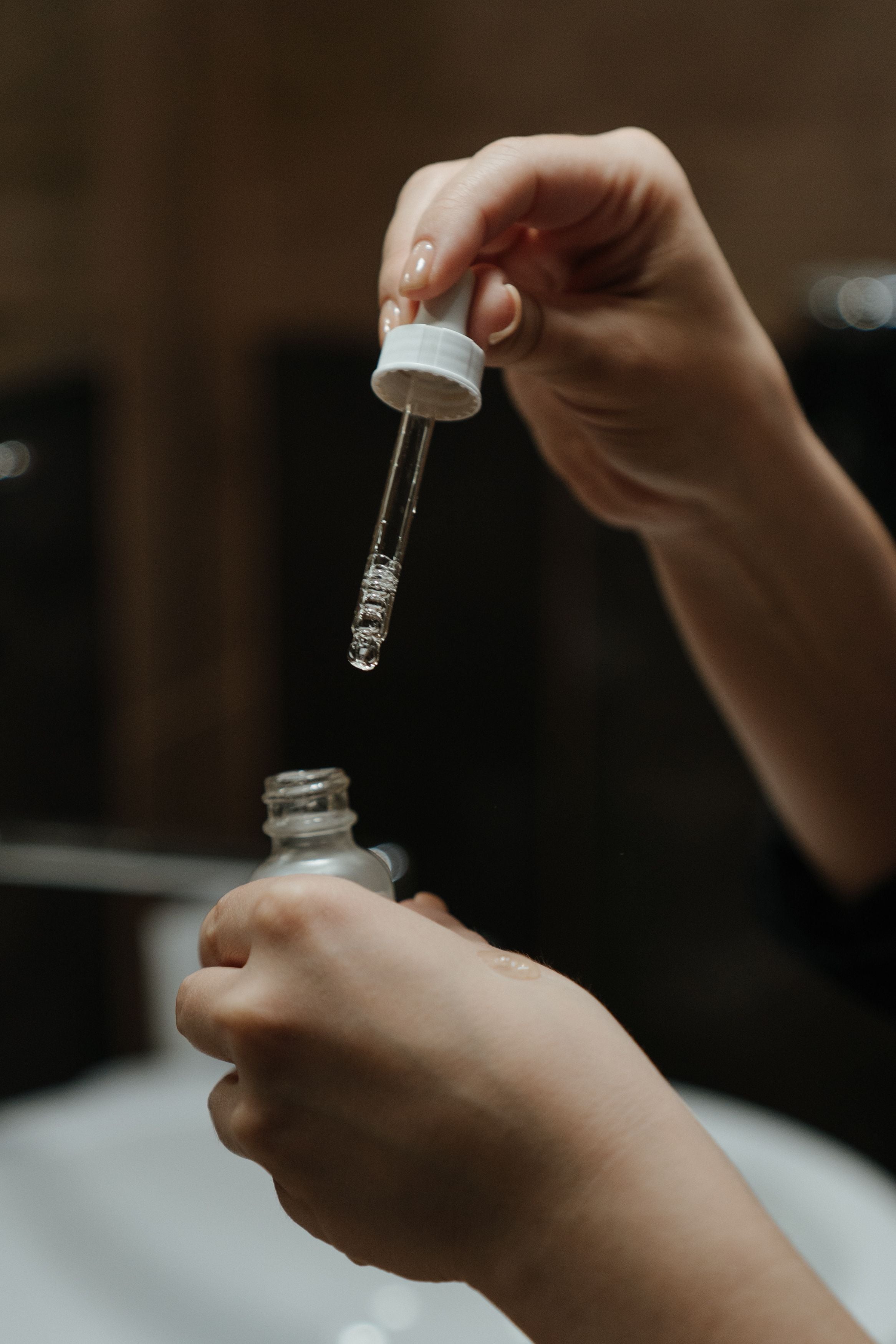 Tranexamic Acid in Skincare - women applying it on her hands