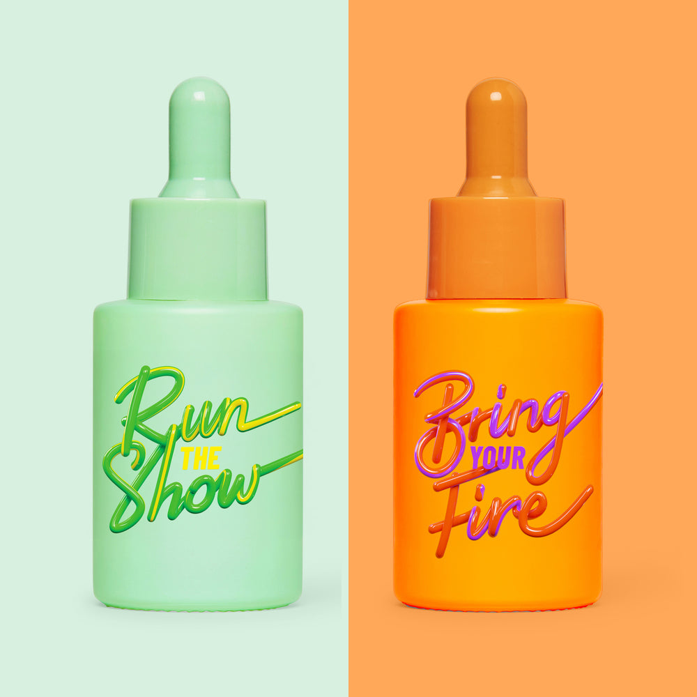 Bundle of HotChi Run The Show and Bring Your Fire facial oils, featuring two glass bottles side by side with golden skincare oils.