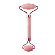 Pink jade facial roller featured in a product shoot, highlighting its smooth texture and elegant design for skincare and facial massage.