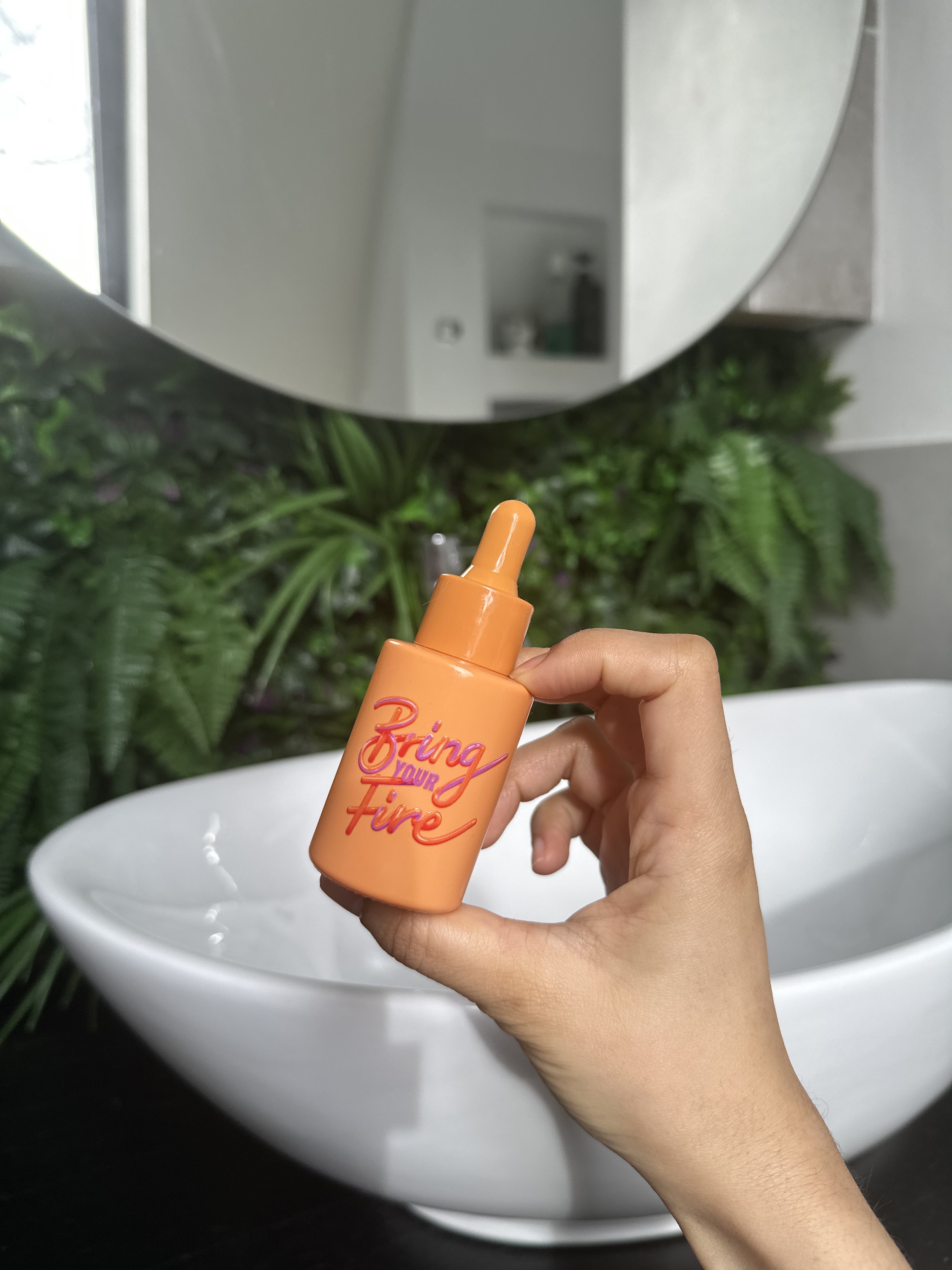 Close-up of HotChi Bring Your Fire skincare product on clean background