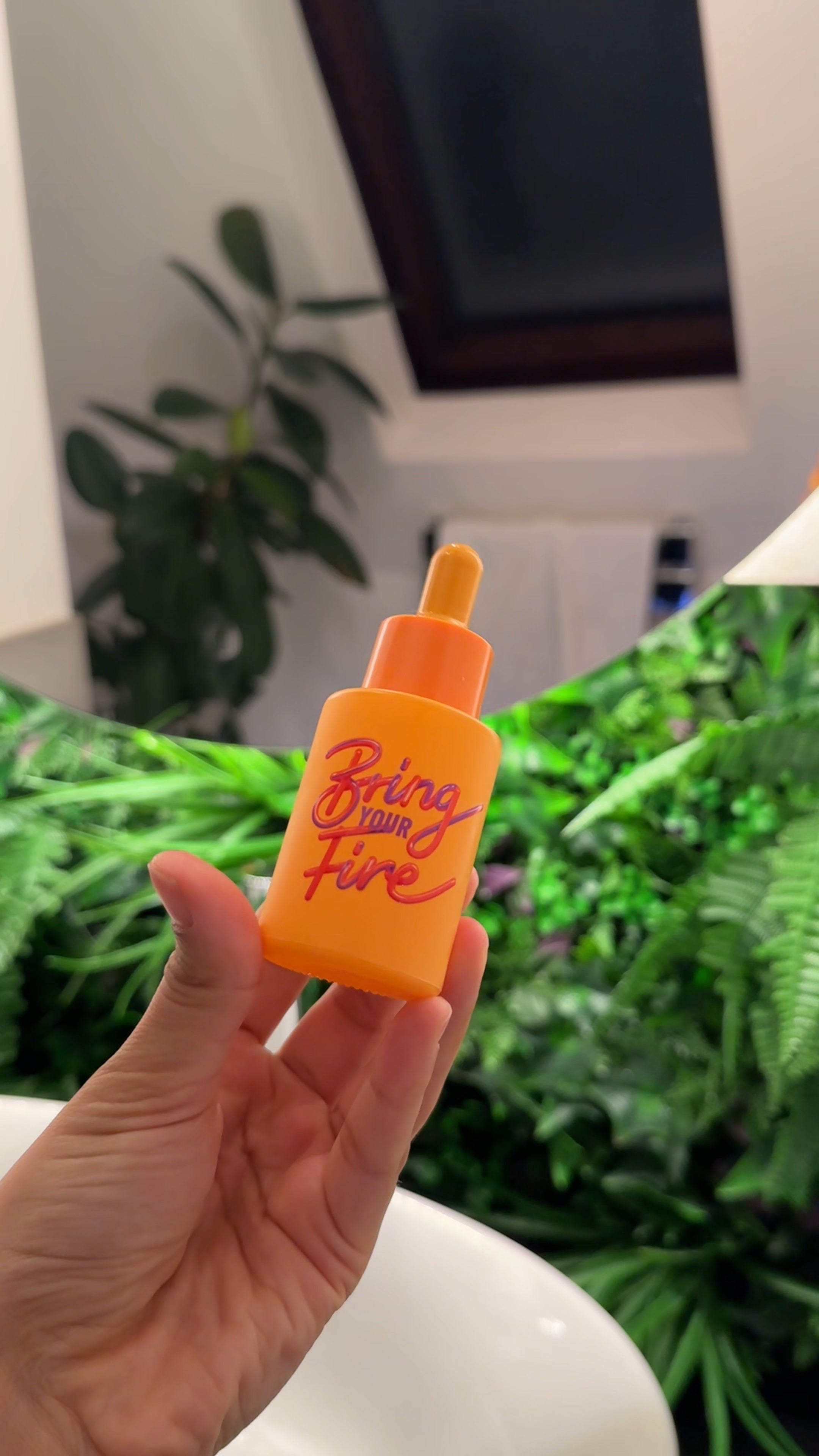 HotChi Bring Your Fire skincare product displayed on desk background