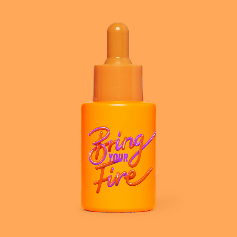 Studio photograph of HotChi’s Bring Your Fire Facial Oil on orange background, symbolising calming, soothing benefits.