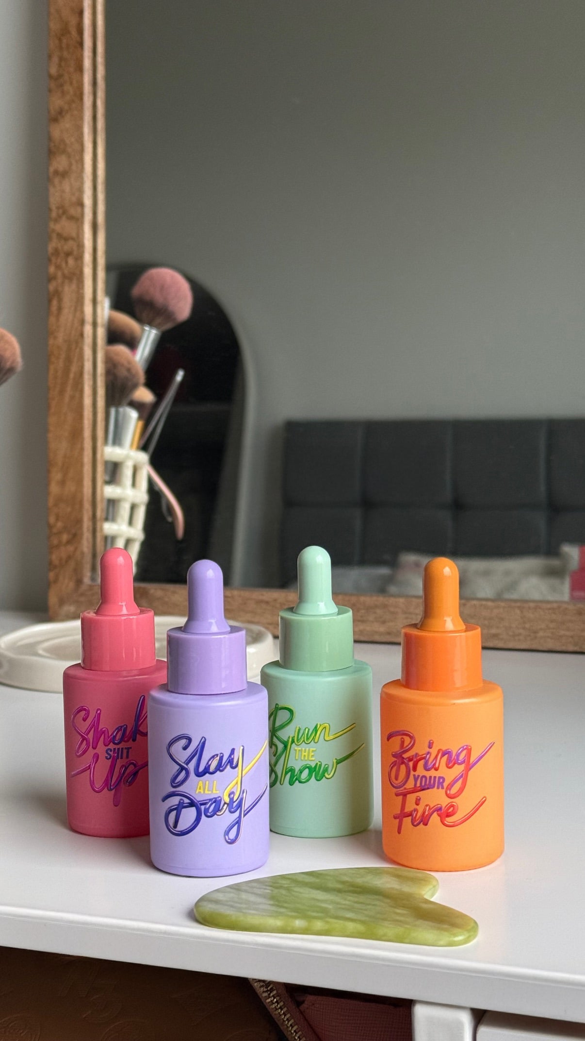All four HotChi skincare products arranged together on a desk