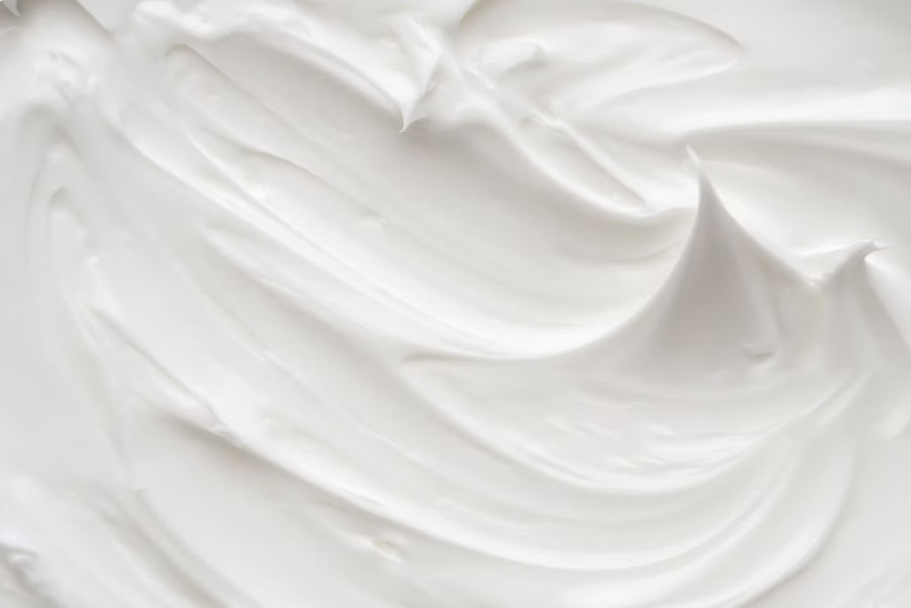Hydrating moisturiser cream texture with soft whipped swirl detail