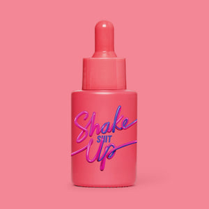 Studio image of HotChi’s Shake It Up Facial Oil on pink-red background, expressing confidence-boosting, revitalising benefits