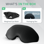 Black weighted sleep eye mask with packaging box on a gray background