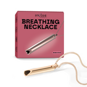 Rose gold breathing necklace with packaging on a white background