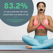 Woman in pink sports bra and blue leggings meditating on a yoga mat with text about user feedback.