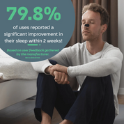 Man sitting on a couch with a text overlay about sleep improvement statistics.