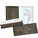 Semillas auriculares de oro 24K Vie Healing – Kit con tabla de semillas para acupresión (20 piezas)